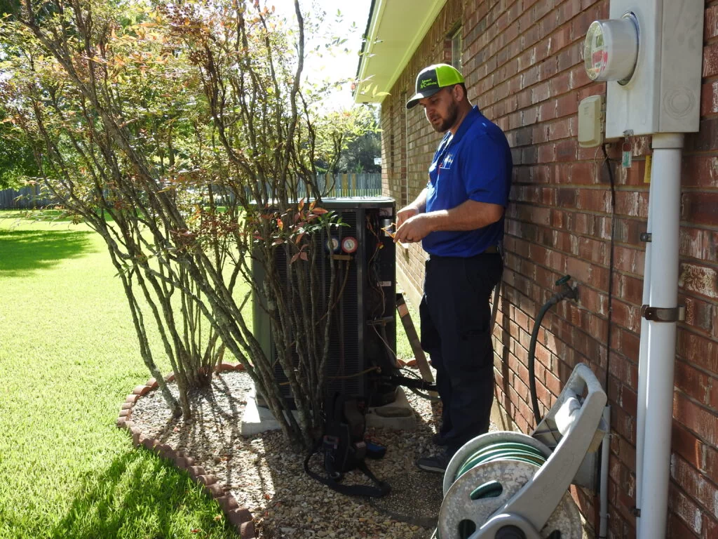 HVAC Tech Doing HVAC Maintenance